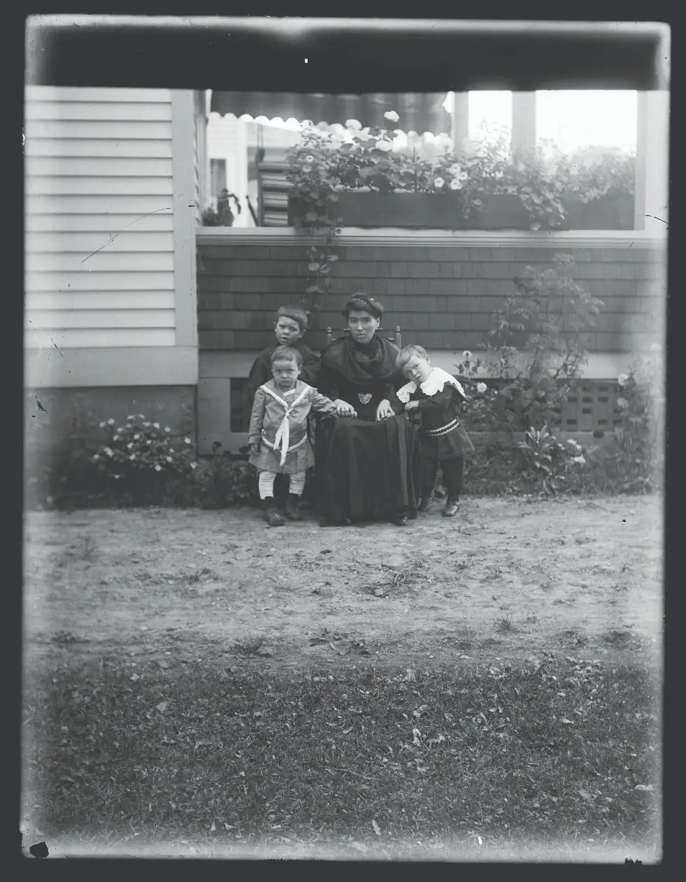 Mother & 3 young children ca. 1890-1915.